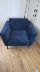 Blue velvet armchair.  Buyer must arrange for transport