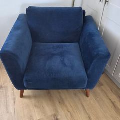 Blue velvet armchair.  Buyer must arrange for transport