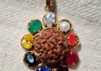 Rudraksha seed pendant with natural precious stones ruby emerald sapphire