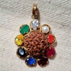 Rudraksha seed pendant with natural precious stones ruby emerald sapphire