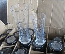 A box of Carlsberg glasses (pint & half pint)