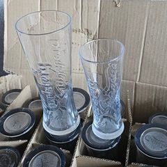 A box of Carlsberg glasses (pint & half pint)