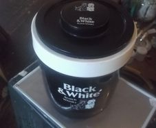 a black and white  scotch whisky ice bucket
