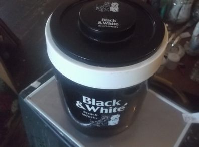 a black and white  scotch whisky ice bucket