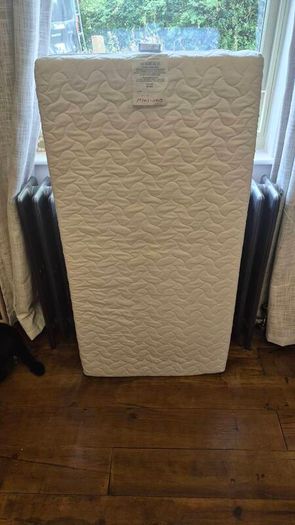 Nested wooden cot with mattress