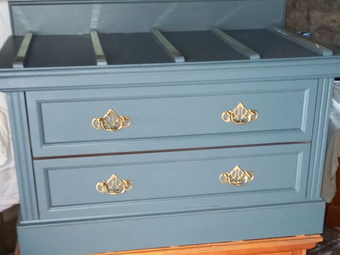 Chest drawers with brass strip suitcase set down