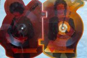 Rare and collectible Gary Moore and Phil Lynott special 2 in 1 shaped picture disc. Out in the fields and military man. Bought this new back in the day. Records were never played but picture disc discoloured over time as all versions did. Still highly col