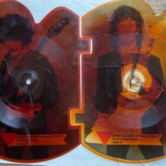 Rare and collectible Gary Moore and Phil Lynott special 2 in 1 shaped picture disc. Out in the fields and military man. Bought this new back in the day. Records were never played but picture disc discoloured over time as all versions did. Still highly col