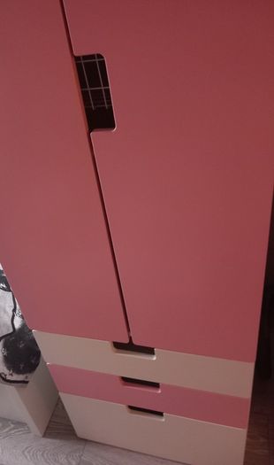 Pink and white children's wardrobe with internal wire baskets