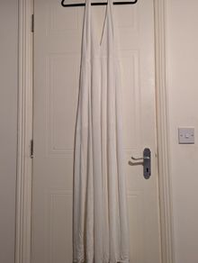 beautiful full length white halterneck dress by Wyldr