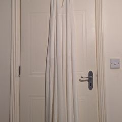 beautiful full length white halterneck dress by Wyldr