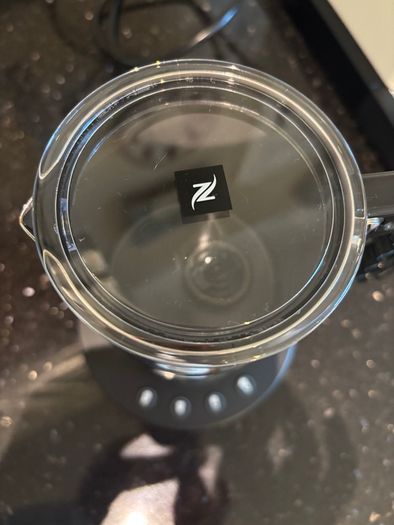Nespresso espresso machine, milk frother and cups