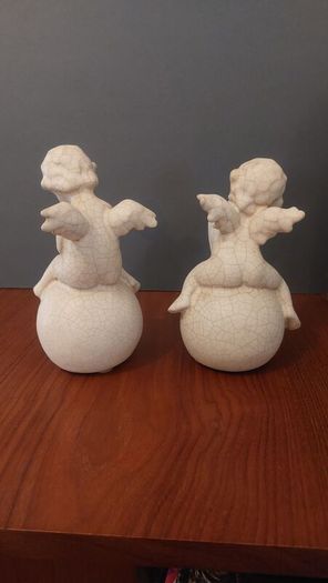 Lovely Vintage Pair of Ceramic Baby Winged Angels Sitting on Globes with a Very Tactile Cream Coloured Crackle Glaze