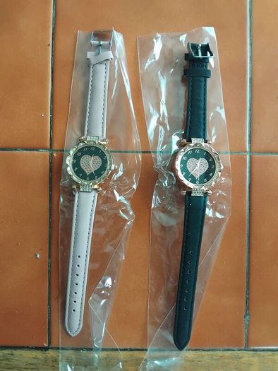 2 womens watches with leather straps