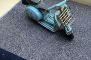 Vintage blue metal model of a Vespa