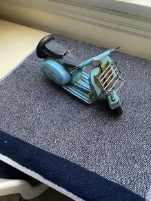 Vintage blue metal model of a Vespa