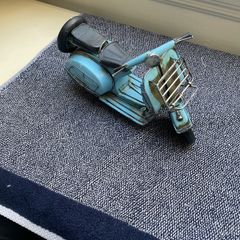 Vintage blue metal model of a Vespa