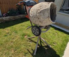 Petrol cement mixer with stand