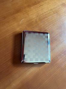 Brand new zippo and silver cigarette case.