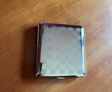 Brand new zippo and silver cigarette case.