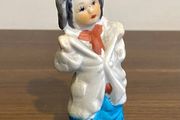Vintage Bisque Figurine Of a Boy in Oversized Clothes