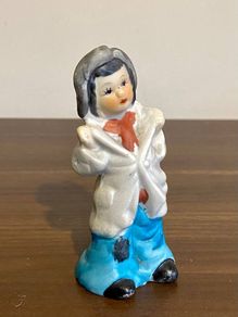 Vintage Bisque Figurine Of a Boy in Oversized Clothes