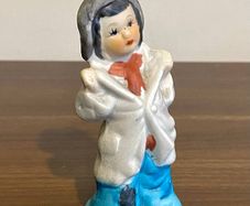 Vintage Bisque Figurine Of a Boy in Oversized Clothes