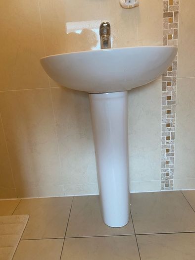 Sink pedestal and tap
