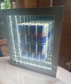 Red Bull mirror art with lighting,