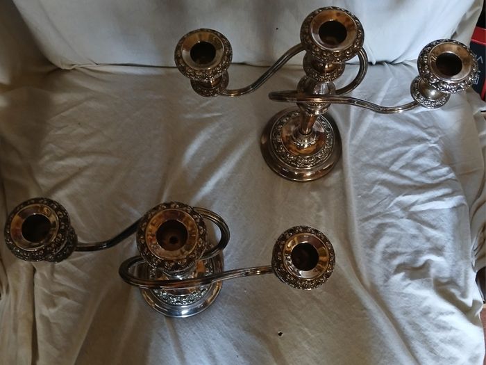 a matching pair of traditional three light candlelabras silver plated