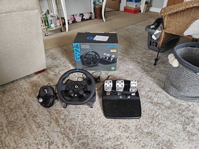 Logitech G923 Wheel with pedals and shifter.