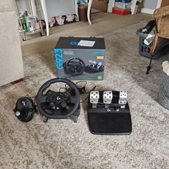Logitech G923 Wheel with pedals and shifter.