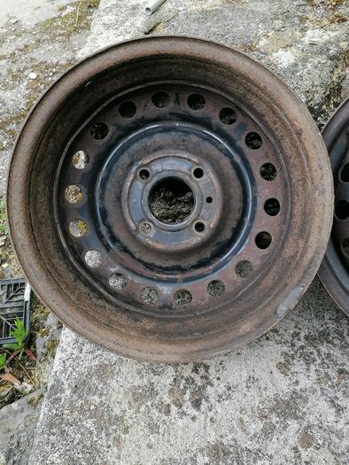 2 x steel rims 15", 4 stud, about 114mm ish from hole centre to the opposite home centre... Possibly fit a nissan etc