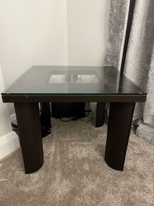 Square Glass coffe table with brown leather upholstery