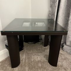 Square Glass coffe table with brown leather upholstery
