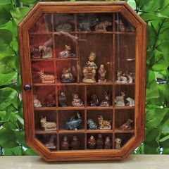 vintage glass display wall cabinet with Wade collection figurines