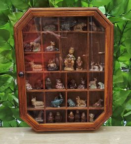 vintage glass display wall cabinet with Wade collection figurines