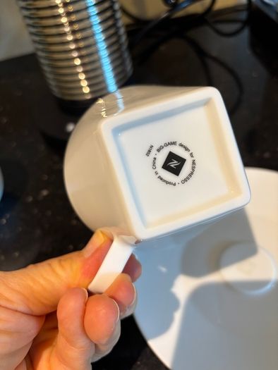 Nespresso espresso machine, milk frother and cups
