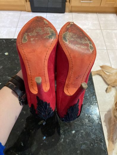 Red high heeled shoes with black lace