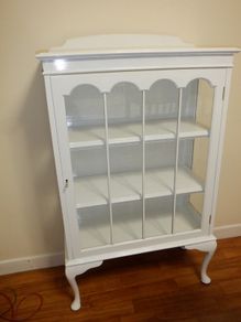 White display cabinet with glass door and shelves