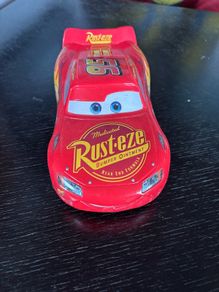 This toy is a Disney Pixar Cars Lightning McQueen die-cast vehicle from Mattel