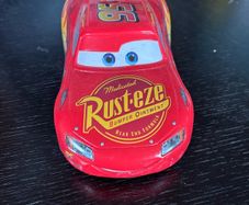 This toy is a Disney Pixar Cars Lightning McQueen die-cast vehicle from Mattel
