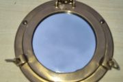 Decorative mirror in the shape of a ship's porthole