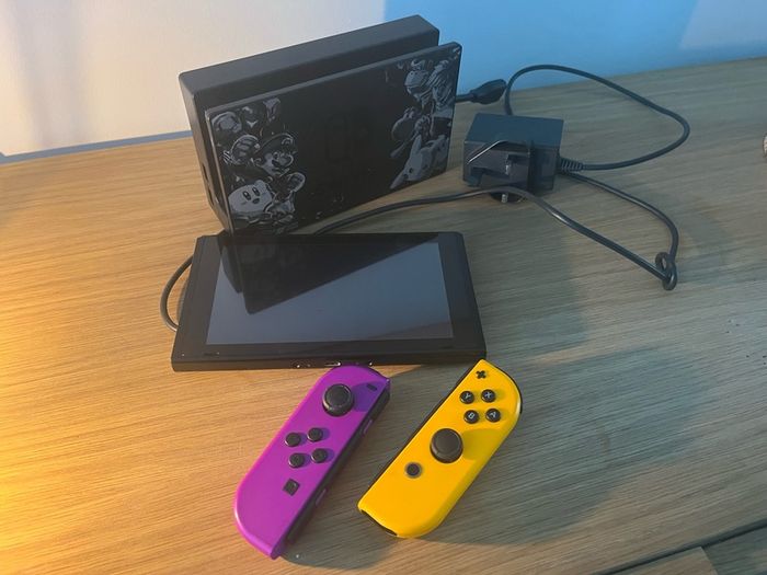 Nintendo Switch Console with Dock and Charger. Fully working, Purple and Orange joycons