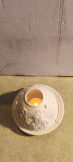 Nordic Lights porcelain tea light holder dome featuring a cat or dog theme.