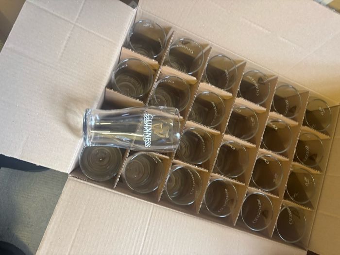 guiness pint glasses and beer mats