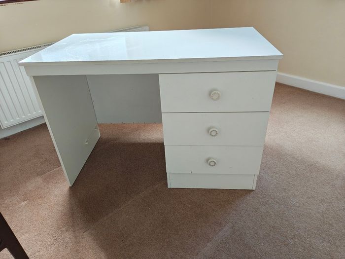 White desk with three good sized drawers.