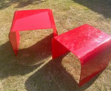 Two nesting designer glass tables