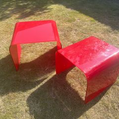 Two nesting designer glass tables