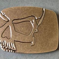 Belt buckle, skull design.